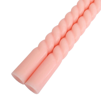 Pink twisted candles for home decor, elegant and stylish.
