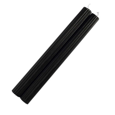 Black candle sticks in a studio-style isolation shot.