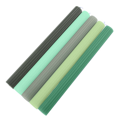 Set of five ribbed candles in various shades of green and gray