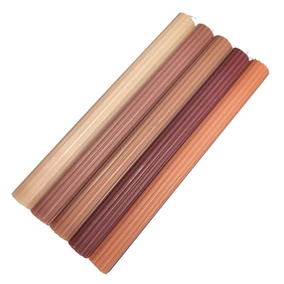 Set of six ribbed candle holders in various warm tones