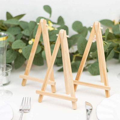 Mini wooden easels for table decor and art display.