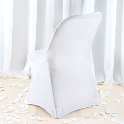 White chair cover on a plain background with rose petals scattered around.