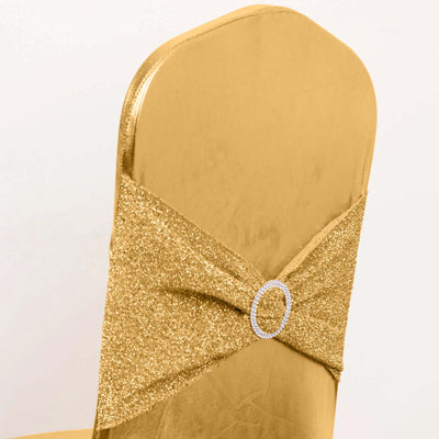 Gold chair cover with sparkling bow and rhinestone accent.