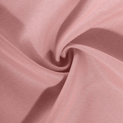 Soft pink textured fabric swirled in a circular pattern.