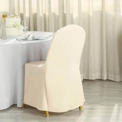 Elegant beige dining chair with gold legs in a bright, airy setting.