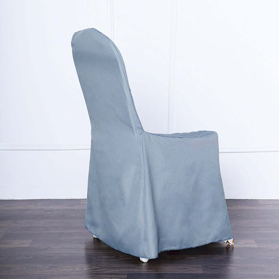 Gray chair cover on a wooden floor, showcasing a tailored fit.