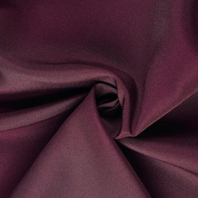 Burgundy fabric texture showcasing soft drape and sheen.