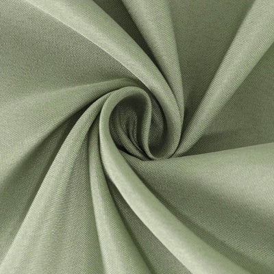 Textured green fabric in a spiral fold revealing its softness and quality.