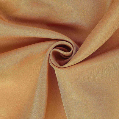 Textured golden-brown fabric with a soft, smooth finish.
