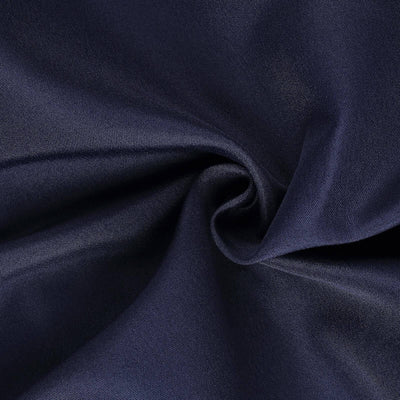 Navy blue fabric swirl showing smooth texture and sheen.