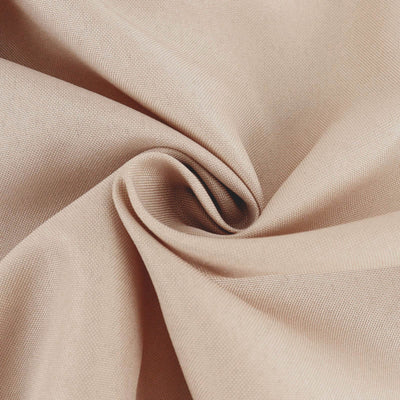 Close-up of soft beige fabric showcasing texture and drape.