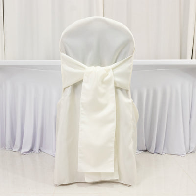 Elegant white chair cover with bow, perfect for weddings and events.