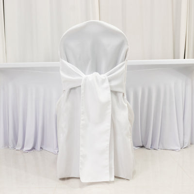 White chair cover with a large bow, styled for an elegant event.