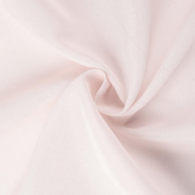 Close-up of soft pink fabric texture.