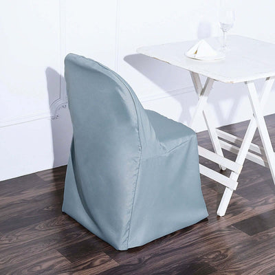 Modern grey chair with a sleek design in a minimalist setting.