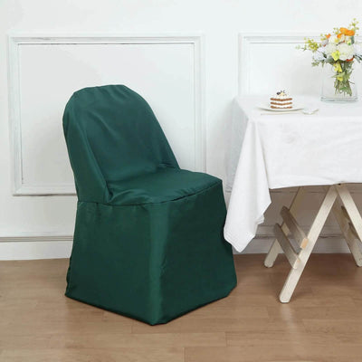 Green chair cover on a dining chair beside a table with a cake.