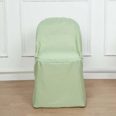Green chair cover on a plain chair against a white backdrop