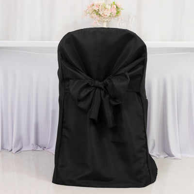 Black chair cover with bow detail, elegantly styled for events.