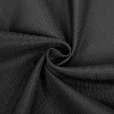 Black fabric texture close-up showcasing smooth weave and depth.
