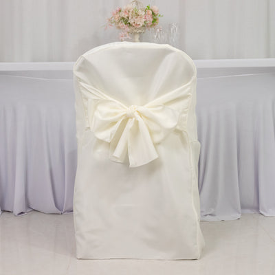 White chair cover with bow for elegant event decor.