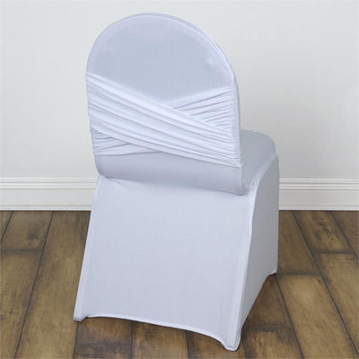 White chair cover with crisscross design on a wooden floor.
