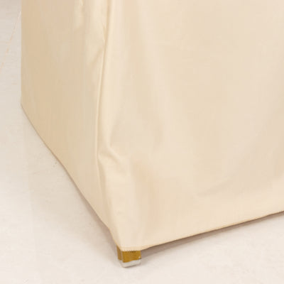 Cream-colored storage ottoman with sleek design and golden feet.