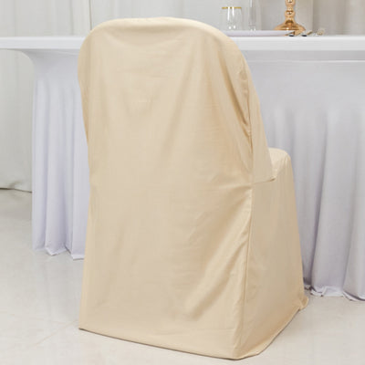 Beige chair cover draped over a simple chair in a banquet setting.