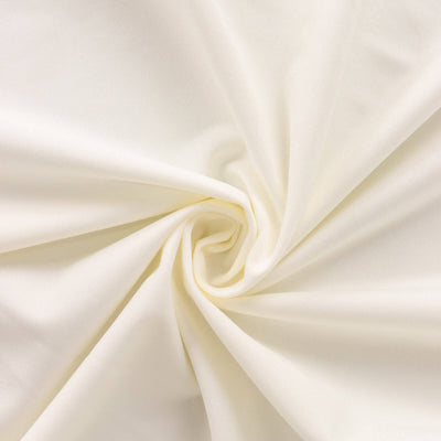 Cream fabric texture in a swirling pattern.