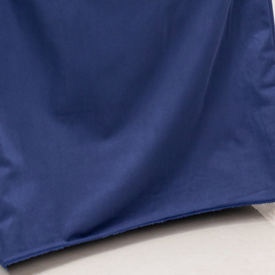 Navy blue fabric draped elegantly, showcasing its smooth texture and rich color.