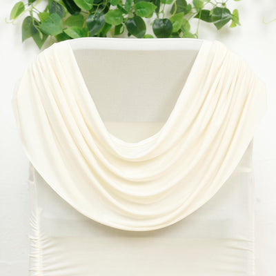 Cream draped fabric on a white backdrop