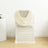 Cream draped chair cover on a white backdrop