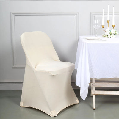 Cream-colored chair cover draped over a chair beside a dining table.