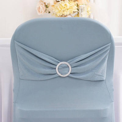 Elegant blue chair cover with embellishment for event decor.