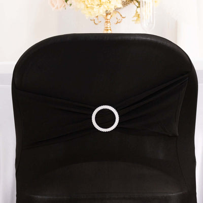 Black chair cover with pearl embellishment on the back.