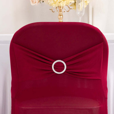 Burgundy chair cover with a pearl circle embellishment