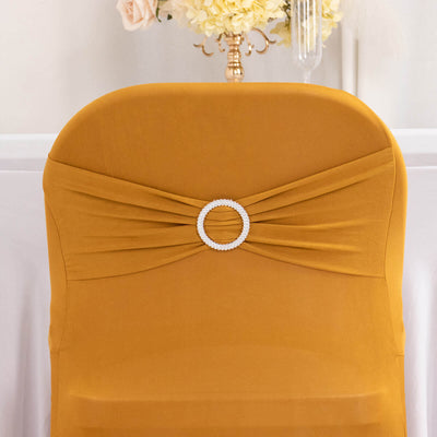 Elegant mustard chair cover with pearl accent for event decor.