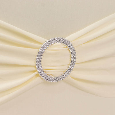 Elegant yellow fabric with a sparkling rhinestone brooch detail.
