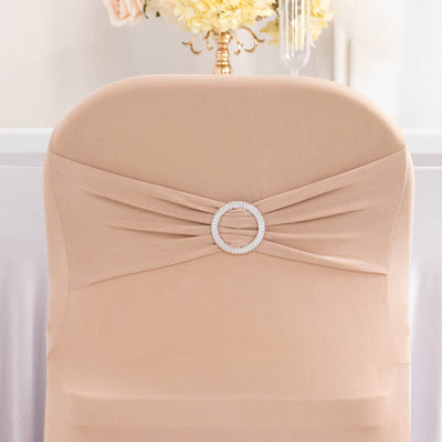 Beige chair cover with decorative rhinestone buckle detail