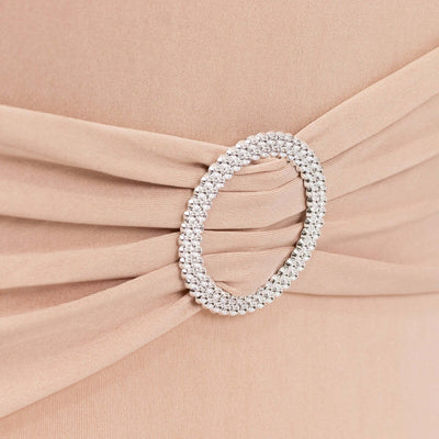 Elegant dress detail featuring a rhinestone-embellished belt buckle.