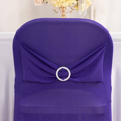 Purple chair cover with a decorative rhinestone circle.