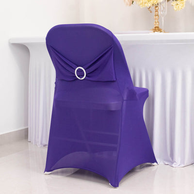 Purple chair cover with decorative back detail, perfect for events and parties.