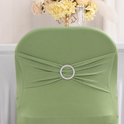 Green chair cover with rhinestone accent on a plain backdrop.