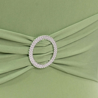 Green dress with embellished belt detail.