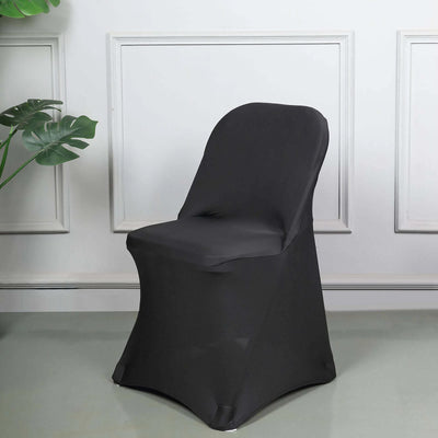 Black stretch chair cover on a sleek chair in a modern setting.