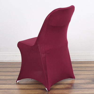 Maroon fitted chair cover on a wooden floor