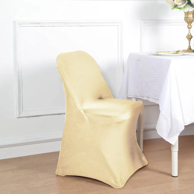 Beige stretch chair cover on a dining chair beside a table.