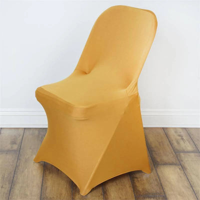 Yellow stretch chair cover on a wooden floor.