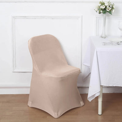 Beige chair cover draped over a chair in a dining setting.