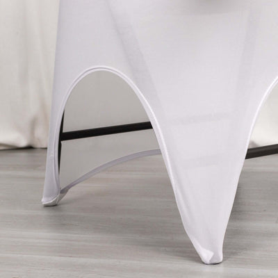 White table cover draping over a black metal table frame.