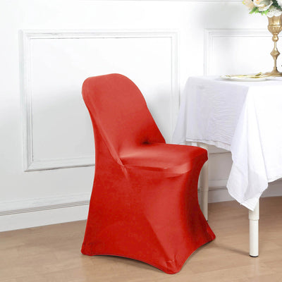 Red chair cover on a dining chair in a decorated dining space.